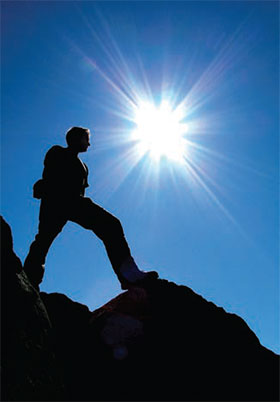 standing on a mountain