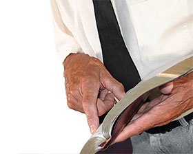 pointing at Bible