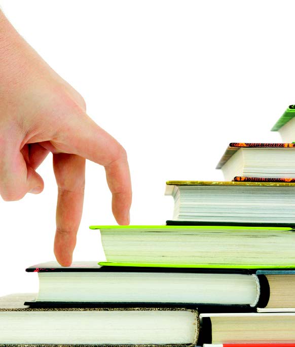 finger legs walking up a stack of book stairs